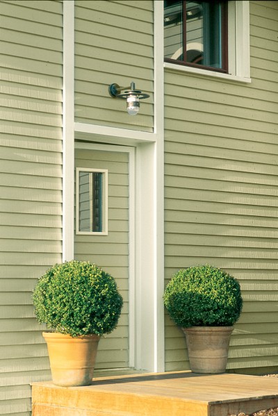 Façade bardage bois vert Tollens, lasure bois teintée